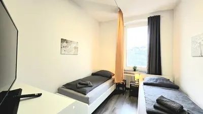 Ein Bett oder Betten in einem Zimmer der Unterkunft Modernes Apartment mit Einzelbetten & WLAN & kostenlosen Parkplätzen & voll ausgestattet in Altena