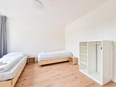 Ein Bett oder Betten in einem Zimmer der Unterkunft Tolstov Apartments - 3 and 4 Room Apartments