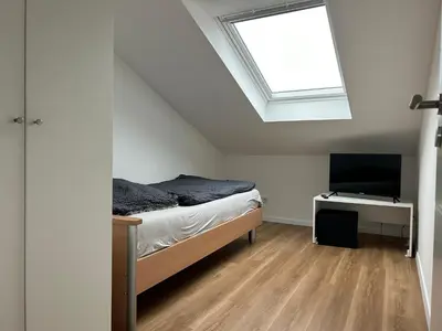 Ein Bett oder Betten in einem Zimmer der Unterkunft Moderne Service Apartment / Ferienwohnung