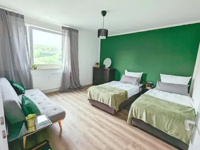 Ein Bett oder Betten in einem Zimmer der Unterkunft Schöne Wohnung mit Balkon/Parkplatz/Aufzug