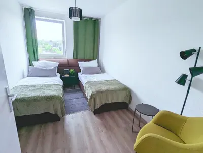 Ein Bett oder Betten in einem Zimmer der Unterkunft Schöne Wohnung mit Balkon/Parkplatz/Aufzug