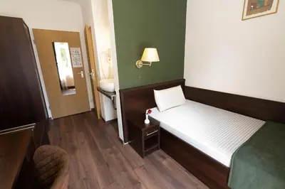 Ein Bett oder Betten in einem Zimmer der Unterkunft Jupa's Hotel