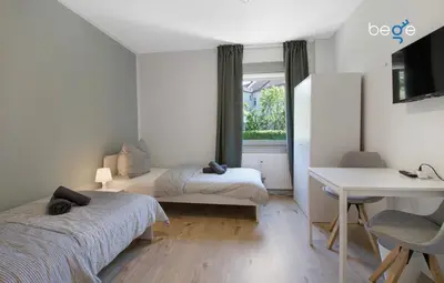 Ein Bett oder Betten in einem Zimmer der Unterkunft BEGE APARTMENTS: STAY & WORK