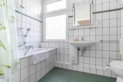 Ein Badezimmer in der Unterkunft WORKER'S HOME F7 - Haus mit 4 Schlafzimmern für 8 Personen