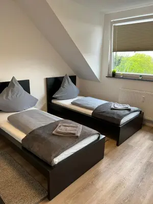 Ein Bett oder Betten in einem Zimmer der Unterkunft LiRo Apartments Eppinghoferstrasse 87 Mülheim