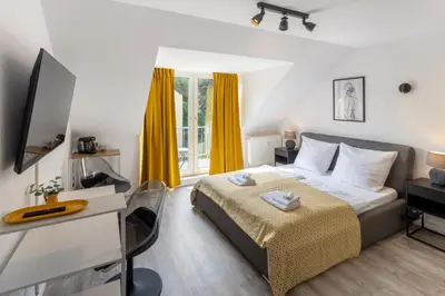 Ein Bett oder Betten in einem Zimmer der Unterkunft MINT: Design Studio – Parken – Küche – WiFi