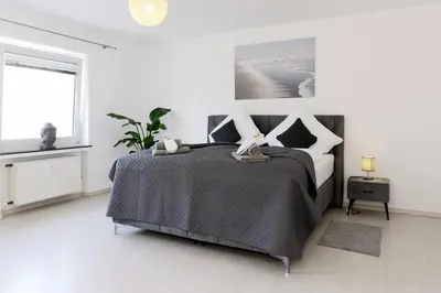 Ein Bett oder Betten in einem Zimmer der Unterkunft Luxus über 2 Etagen mit Balkon in Elberfeld