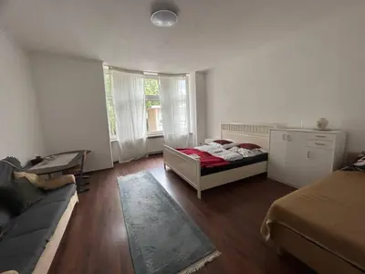 Ein Bett oder Betten in einem Zimmer der Unterkunft 3 Zimmer Mietwohnung nähe HBF