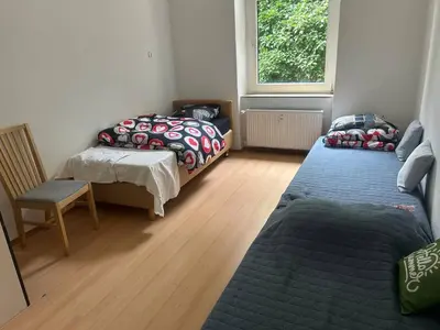 Ein Bett oder Betten in einem Zimmer der Unterkunft 3 Zimmer Mietwohnung nähe HBF