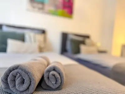 Ein Bett oder Betten in einem Zimmer der Unterkunft Gockel Homes - Zentral mit Balkon & Netflix