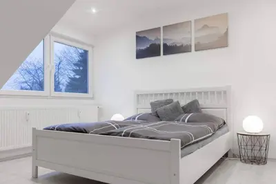 Ein Bett oder Betten in einem Zimmer der Unterkunft Top ausgestattet Netflix Wifi Veltins Arena