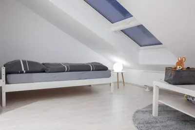 Ein Bett oder Betten in einem Zimmer der Unterkunft Top ausgestattet Netflix Wifi Veltins Arena