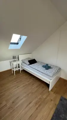 Ein Bett oder Betten in einem Zimmer der Unterkunft Apartmenthaus Somborn