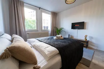 Ein Bett oder Betten in einem Zimmer der Unterkunft Zentral & Modern nahe Hauptbahnhof mit Privatparkplatz & schnellem WLAN