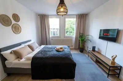 Ein Bett oder Betten in einem Zimmer der Unterkunft Zentral & Modern nahe Hauptbahnhof mit Privatparkplatz & schnellem WLAN