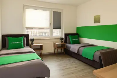 Ein Bett oder Betten in einem Zimmer der Unterkunft Livemore24 - Apartment 2 in Duisburg WLAN - Smart-TV - 24-7 Check-in und Küche