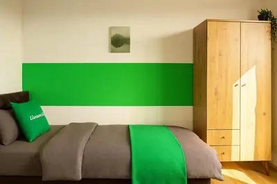 Ein Bett oder Betten in einem Zimmer der Unterkunft Livemore24 - Apartment 2 in Duisburg WLAN - Smart-TV - 24-7 Check-in und Küche