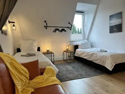 Ein Bett oder Betten in einem Zimmer der Unterkunft Stylish im Altbau, Netflix, Sonos, nahe 3M und Vorwerk