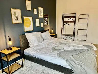 Ein Bett oder Betten in einem Zimmer der Unterkunft Stylish im Altbau, Netflix, Sonos, nahe 3M und Vorwerk