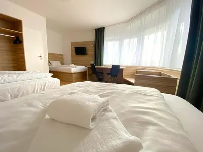 Ein Bett oder Betten in einem Zimmer der Unterkunft Limok Rooms Hamm