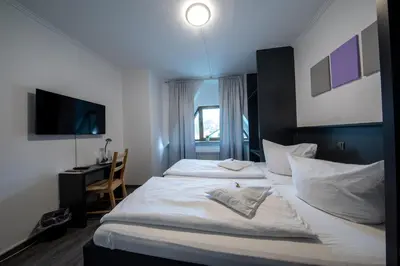 Ein Bett oder Betten in einem Zimmer der Unterkunft Hotel Central