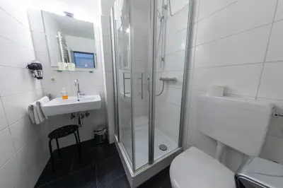 Ein Badezimmer in der Unterkunft Hotel Central