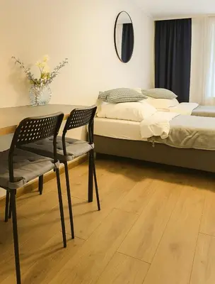 Ein Bett oder Betten in einem Zimmer der Unterkunft Airport Messe Apartments