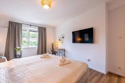 Ein Bett oder Betten in einem Zimmer der Unterkunft Super zentral I Frisch renoviert