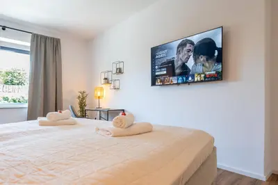 Ein Bett oder Betten in einem Zimmer der Unterkunft Super zentral I Frisch renoviert