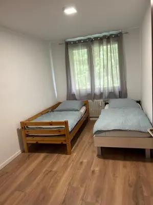 Ein Bett oder Betten in einem Zimmer der Unterkunft Moderne Service Apartment AVD3
