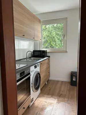 Küche/Küchenzeile in der Unterkunft Moderne Service Apartment AVD3