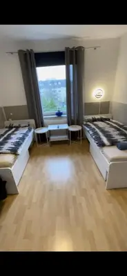 Ein Bett oder Betten in einem Zimmer der Unterkunft Moderne Monteurzimmer Vu