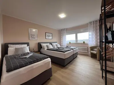 Ein Bett oder Betten in einem Zimmer der Unterkunft Stilvolles Apartment mit ländlichem Ausblick