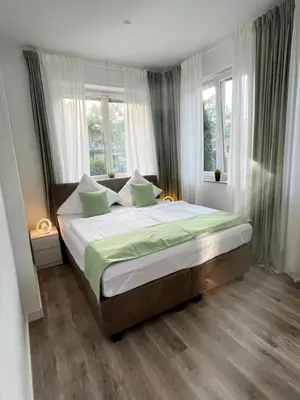 Ein Bett oder Betten in einem Zimmer der Unterkunft Fewo am Wiesengrund