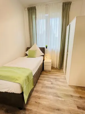 Ein Bett oder Betten in einem Zimmer der Unterkunft Fewo am Wiesengrund