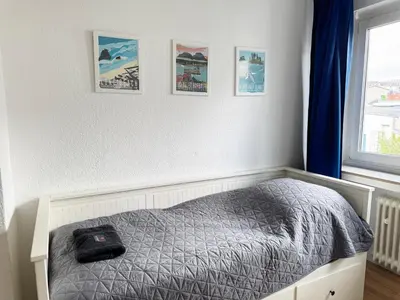 Ein Bett oder Betten in einem Zimmer der Unterkunft 3 Zimmer Apartment mit Garten