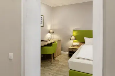 Ein Bett oder Betten in einem Zimmer der Unterkunft Hotel Engelbert