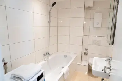 Ein Badezimmer in der Unterkunft TOP! Gemütliches Studio-Apartment zentral, WLAN, Küche