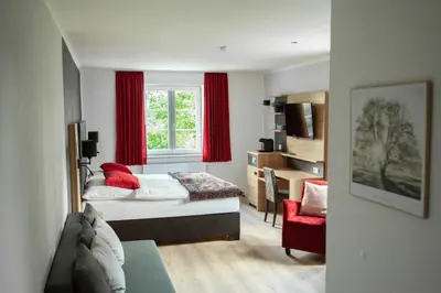 Ein Bett oder Betten in einem Zimmer der Unterkunft Landgasthof Obersteberg