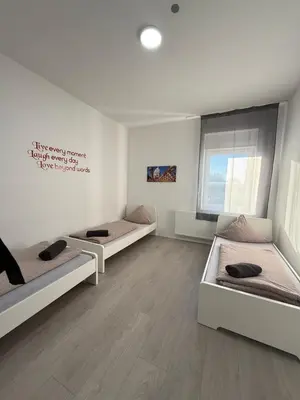Ein Bett oder Betten in einem Zimmer der Unterkunft estrella24 LIVING ROOMS Singapur