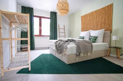 Ein Bett oder Betten in einem Zimmer der Unterkunft HOMEFY - Family Apartment