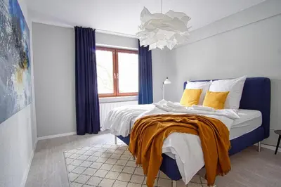 Ein Bett oder Betten in einem Zimmer der Unterkunft HOMEFY - Family Apartment