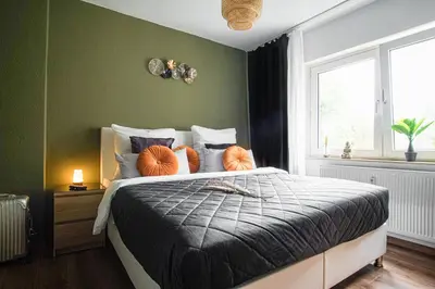 Ein Bett oder Betten in einem Zimmer der Unterkunft Apartment I Wi-Fi I Parkplatz I Balkon EssenFusion