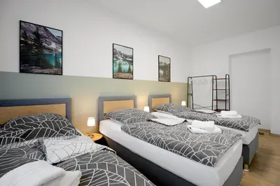 Ein Bett oder Betten in einem Zimmer der Unterkunft Rudi Homes Essen #1