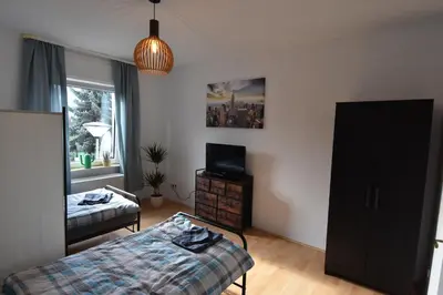 Ein Bett oder Betten in einem Zimmer der Unterkunft Ferienwohnung Hohenlimburg