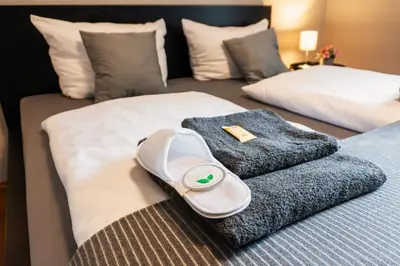 Ein Bett oder Betten in einem Zimmer der Unterkunft Liro Hotel Oberhausen