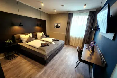 Ein Bett oder Betten in einem Zimmer der Unterkunft Liro Hotel Oberhausen