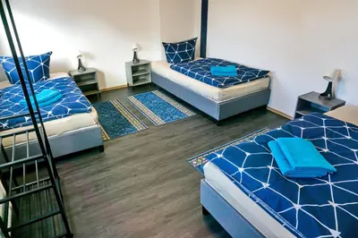 Ein Bett oder Betten in einem Zimmer der Unterkunft BIG Apartment bis 7 Personen
