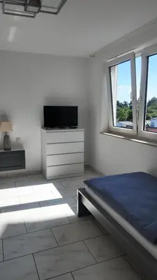 Ein Bett oder Betten in einem Zimmer der Unterkunft 1-5 Pers. Beeindruckende Aussicht, modern+zentral Wuppertal