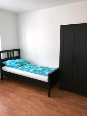 Ein Bett oder Betten in einem Zimmer der Unterkunft White House Bochum Ehrenfeld